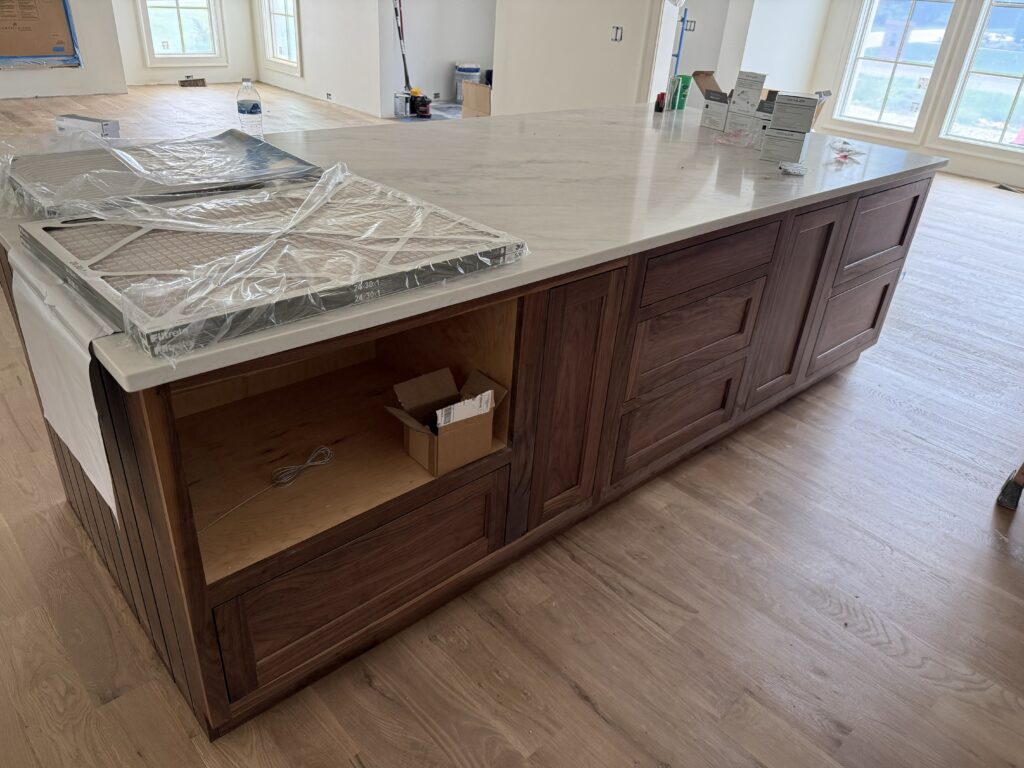 Walnut inset island front cabinetry detail by Tideline Cabinetry