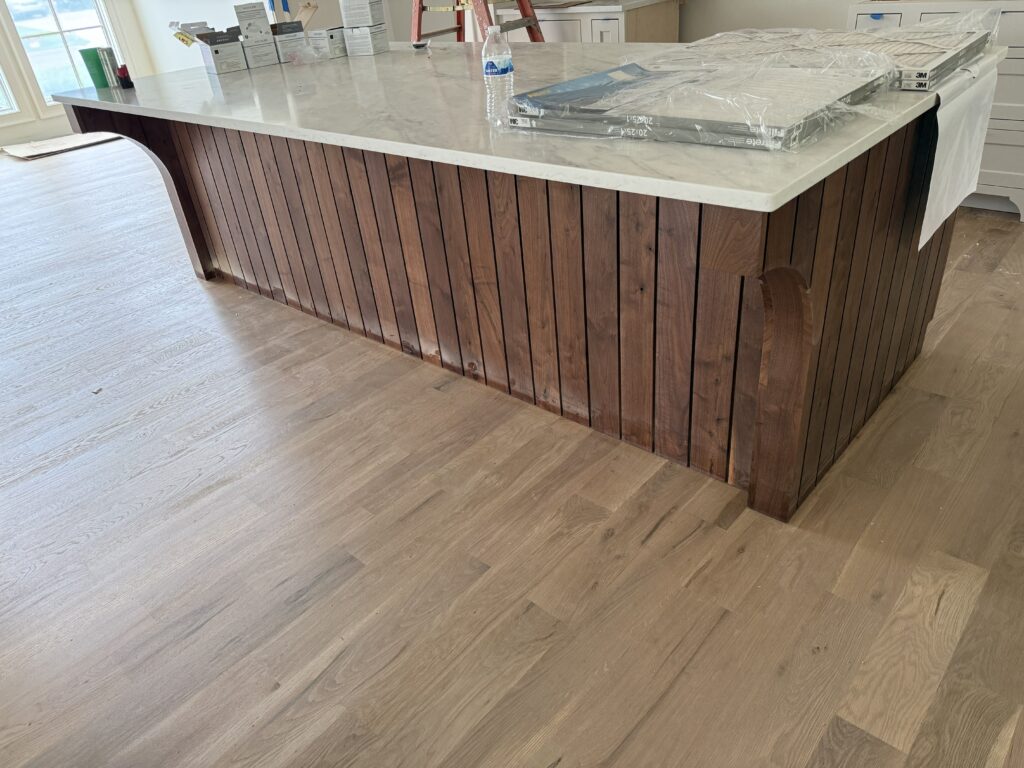 Walnut inset island cabinetry detail by Tideline Cabinetry
