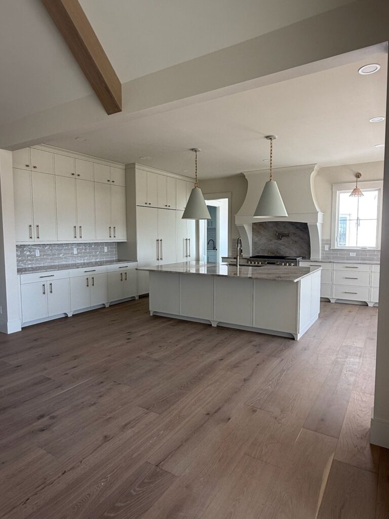 Kitchen With Custom Hood and Hidden Pantry-Oyster White- Skinny Shaker-by Tideline Cabinetry